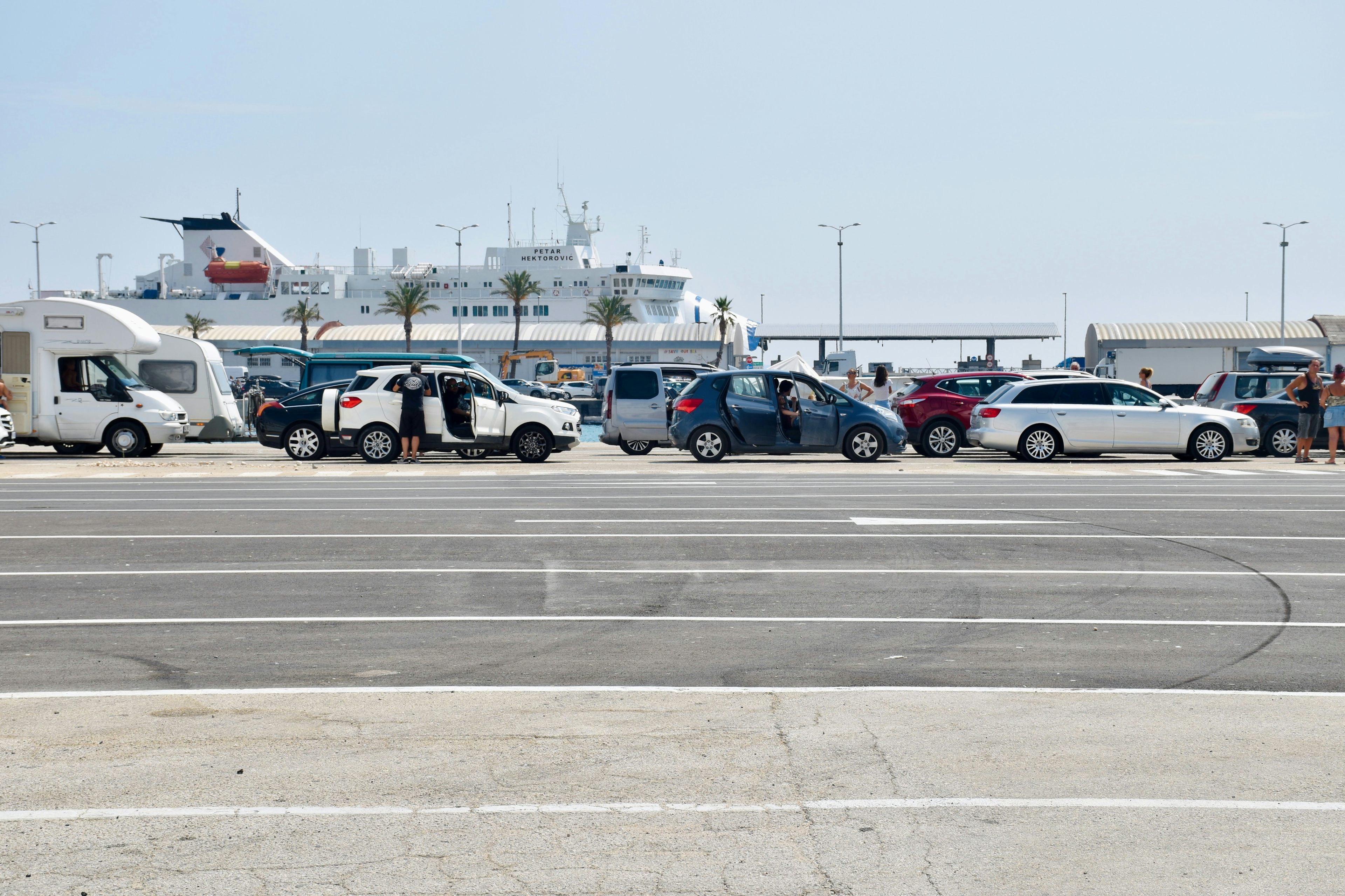 Vehicles queue for ferry entry in Split, Croatia
