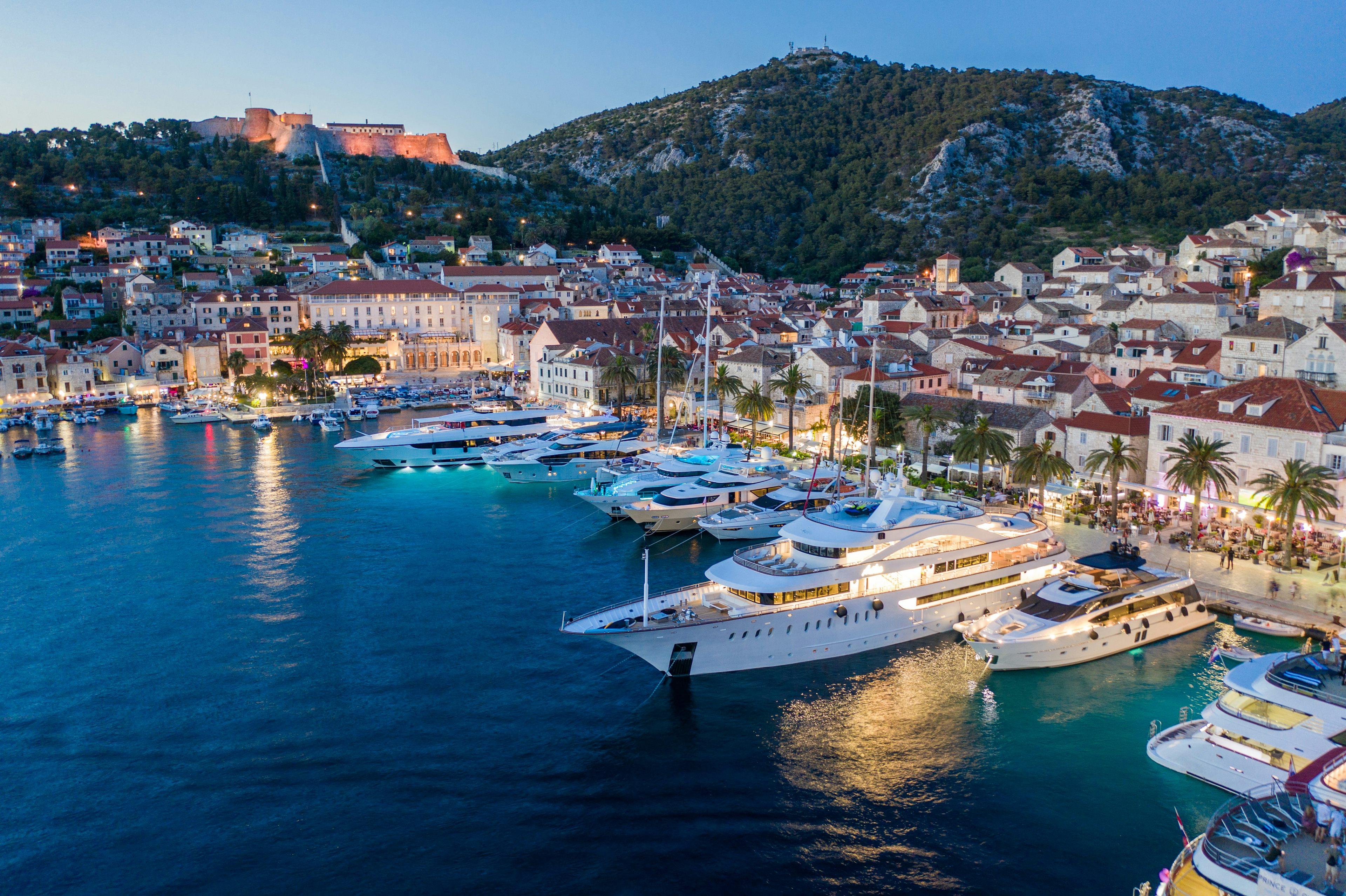 The waterfront of Hvar Town bustling with restaurants and super yachts